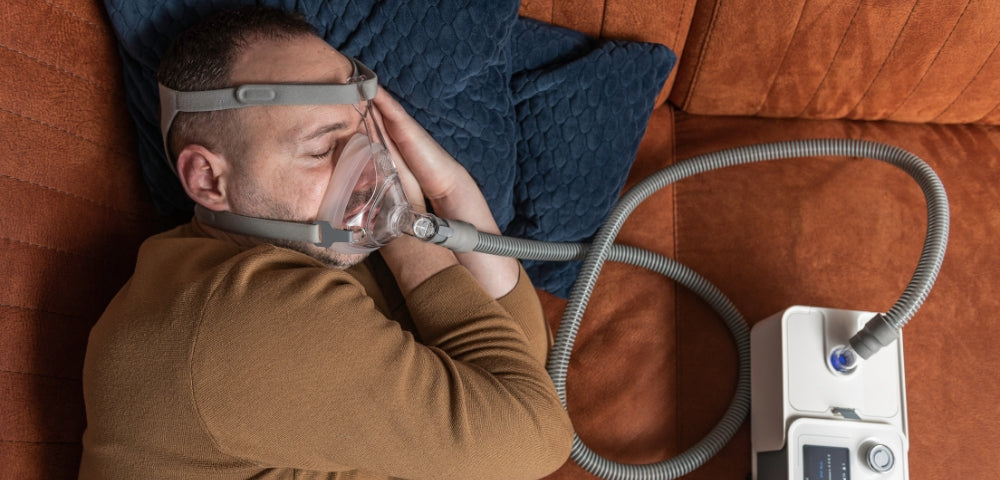 man with cpap device for sleep apnoea